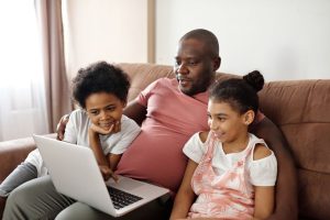 Dad showing his children how to stay safe online